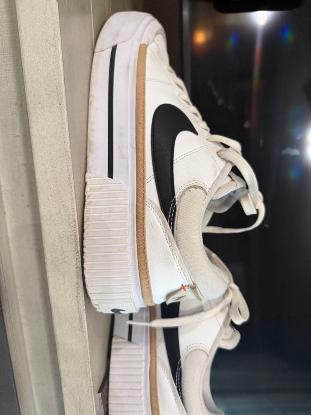 Nike Kids Cream-Trim White Sneakers with Black Swoosh